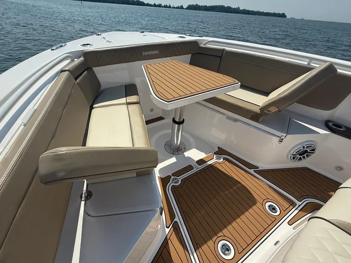  Yacht Photos Pics Luxurious seating area on 2023 Everglades 395 Center Console boat with wood accents.