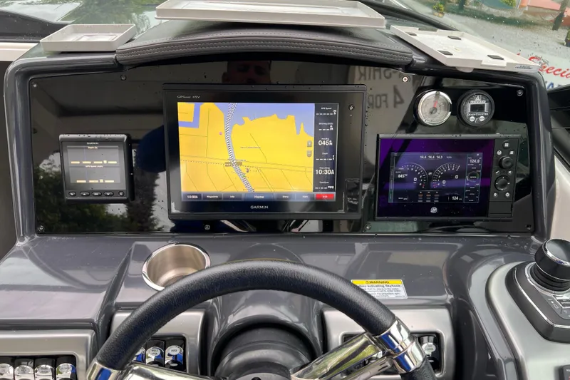 M/v Summer Wind Yacht Photos Pics Dashboard of 2018 Formula 350 Crossover Bowrider OB with Garmin navigation system.
