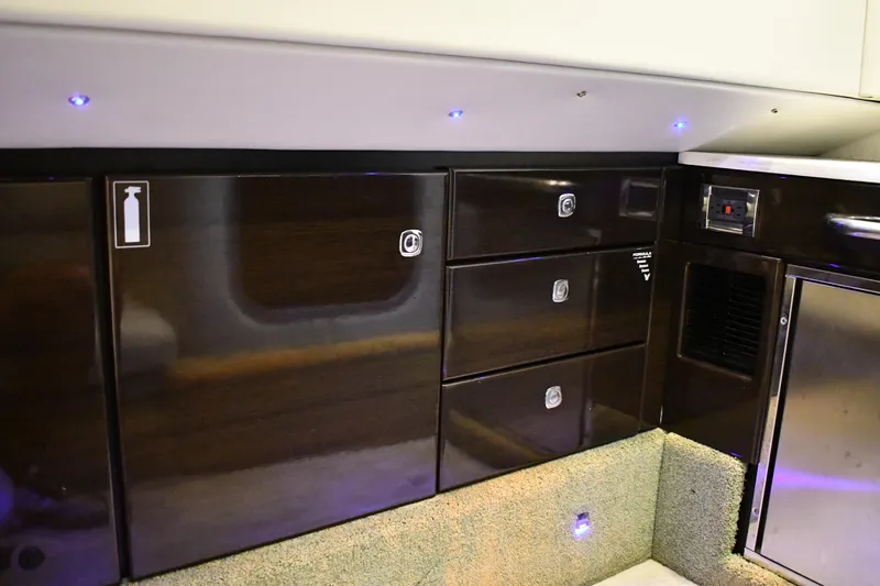 M/v Summer Wind Yacht Photos Pics 2018 Formula 350 Crossover Bowrider OB interior with sleek dark wood cabinetry.