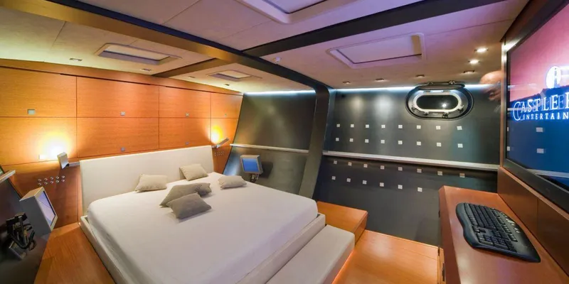 Yamakay Yacht Photos Pics Luxurious bedroom interior of 1994 CMN 39 Modern Schooner with sleek design and ambient lighting.