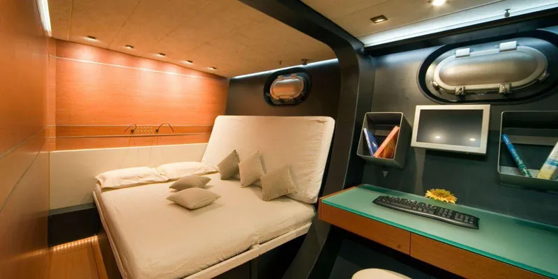 Yamakay Yacht Photos Pics Luxurious cabin interior of 1994 CMN 39 Modern Schooner with bed and desk.