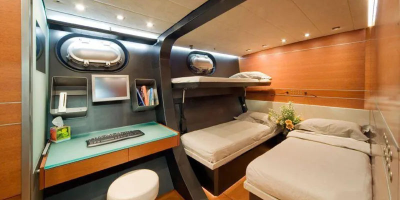 Yamakay Yacht Photos Pics Luxurious cabin interior of 1994 CMN 39 Modern Schooner with bunk beds and workspace.