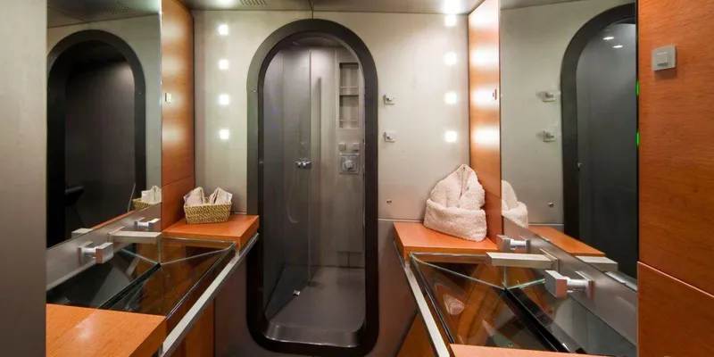 Yamakay Yacht Photos Pics Luxurious bathroom interior on 1994 CMN 39 Modern Schooner, featuring sleek design and mirrored surfaces.