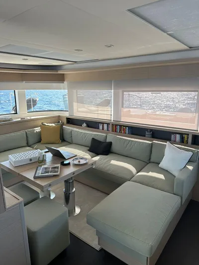  Yacht Photos Pics Luxurious interior of 2023 Lagoon 55 yacht with spacious seating and ocean view.