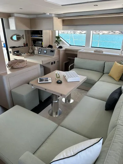  Yacht Photos Pics Luxurious interior of 2023 Lagoon 55 yacht with modern seating and ocean view.