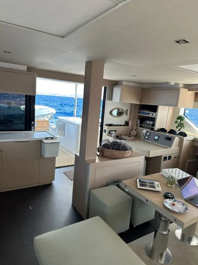 Yacht Photos Pics Interior of 2023 Lagoon 55 yacht with modern design and ocean view.