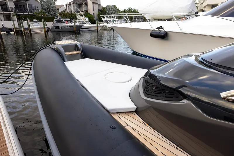 T/t Gypzy Yacht Photos Pics 2024 SACS Strider 11 luxury boat docked in a marina, showcasing sleek design.