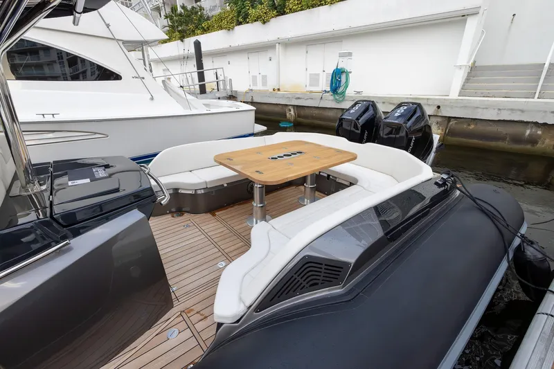 T/t Gypzy Yacht Photos Pics 2024 SACS Strider 11 luxury yacht with elegant seating and dual outboard engines.