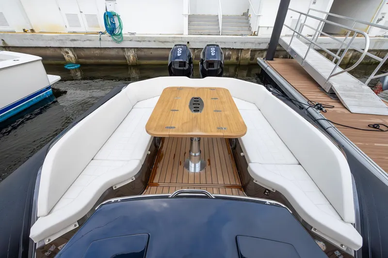 T/t Gypzy Yacht Photos Pics 2024 SACS Strider 11 luxury boat with elegant seating and wooden table.