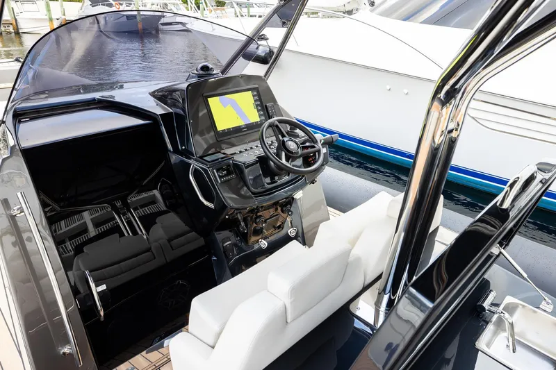 T/t Gypzy Yacht Photos Pics 2024 SACS Strider 11 yacht cockpit with modern steering and navigation system.