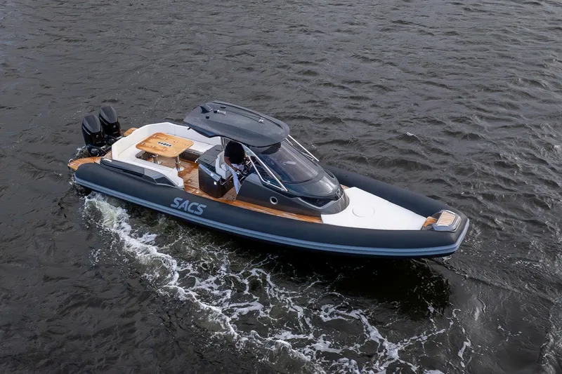 T/t Gypzy Yacht Photos Pics 2024 SACS Strider 11 luxury boat cruising on open water, featuring sleek design and twin engines.