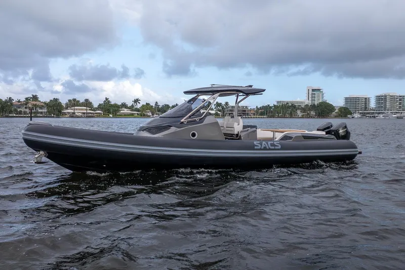 T/t Gypzy Yacht Photos Pics 2024 SACS Strider 11 luxury boat cruising on a scenic waterway.