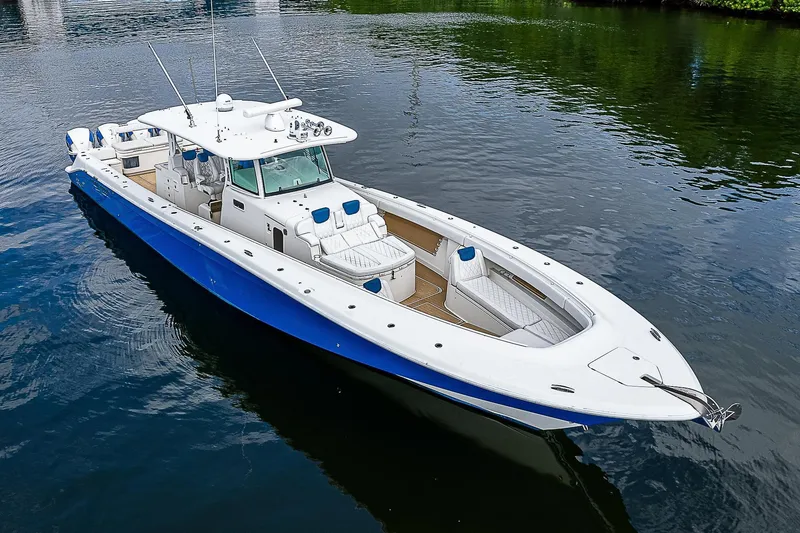  Yacht Photos Pics Luxury 2016 HCB 53 Sueños boat with sleek blue and white design on calm water.