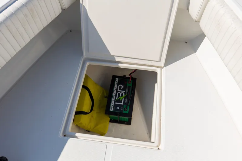 Miss Millie II Yacht Photos Pics Open storage compartment on 2003 Jupiter 31 Open boat with battery and yellow bag.