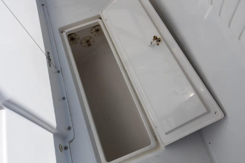 Miss Millie II Yacht Photos Pics Open storage compartment on a 2003 Jupiter 31 Open boat.