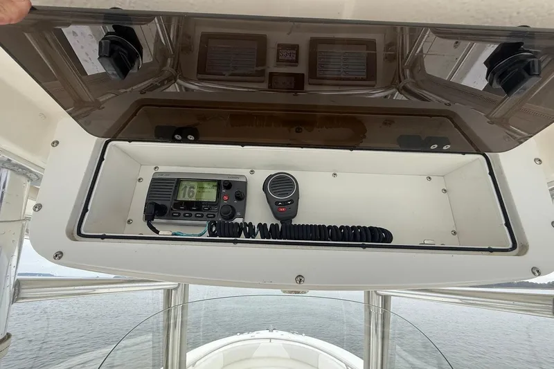  Yacht Photos Pics 2013 Edgewater 318CC boat console with radio and microphone storage.