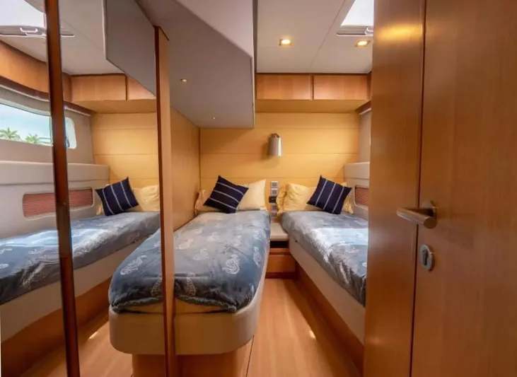  Yacht Photos Pics 2026 McConaghy MC63P Tourer cabin with twin beds, modern design, and wooden interior.
