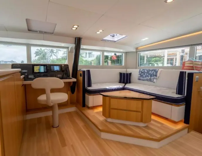  Yacht Photos Pics Luxurious interior of 2026 McConaghy MC63P Tourer yacht with modern seating and navigation area.