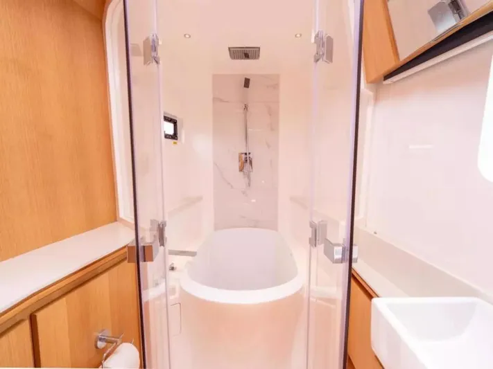  Yacht Photos Pics Luxurious bathroom in 2026 McConaghy MC63P Tourer yacht with modern fixtures and elegant design.