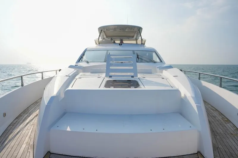  Yacht Photos Pics Sunseeker Manhattan 73 yacht, 2013 model, cruising on open sea under clear sky.