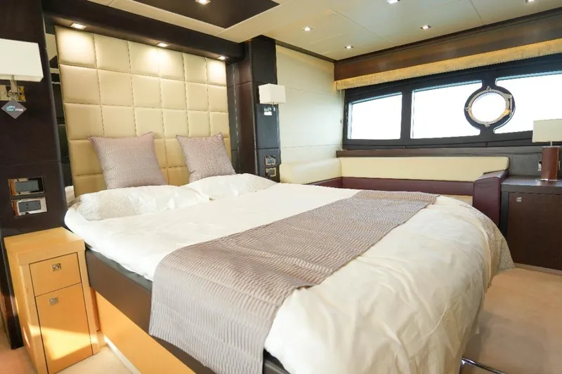  Yacht Photos Pics Luxurious bedroom interior of 2013 Sunseeker Manhattan 73 yacht with elegant decor.