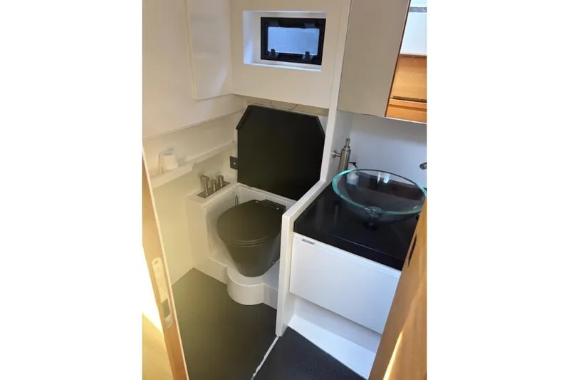 Sparkle Yacht Photos Pics Modern bathroom interior of 2021 Wally Wallytender 48 yacht with sleek fixtures.