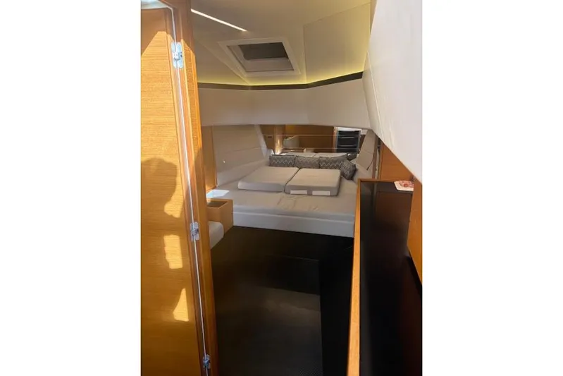 Sparkle Yacht Photos Pics Interior cabin of 2021 Wally Wallytender 48 yacht, featuring modern design and cozy bedding.