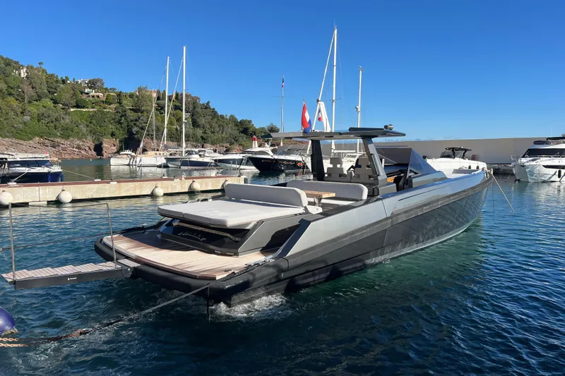 Sparkle Yacht Photos Pics 2021 Wally Wallytender 48 yacht docked in a scenic marina.