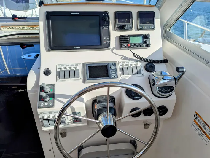 Grand Cove Yacht Photos Pics Helm of 2014 Back Cove 34 boat with navigation equipment and steering wheel.