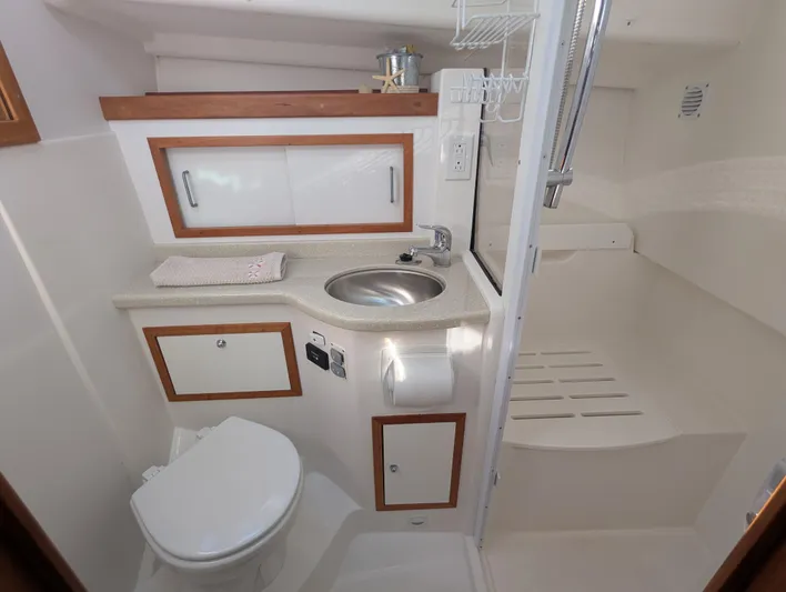 Grand Cove Yacht Photos Pics 2014 Back Cove 34 yacht bathroom with sink, toilet, and shower area.