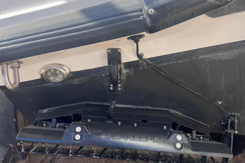 Outta Line Yacht Photos Pics 2017 Boston Whaler 315 Conquest with Seakeeper stabilization system on the hull.