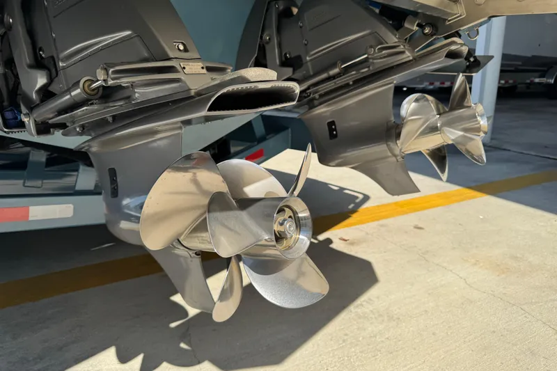  Yacht Photos Pics 2024 Cobalt R33 boat propellers in a sunny outdoor setting.