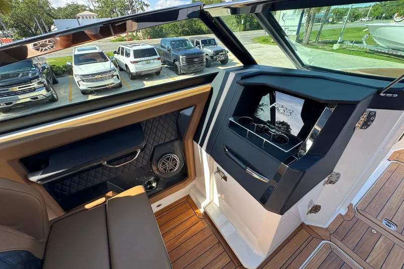  Yacht Photos Pics Interior of 2024 Cobalt R33 boat with luxurious seating and modern dashboard design.