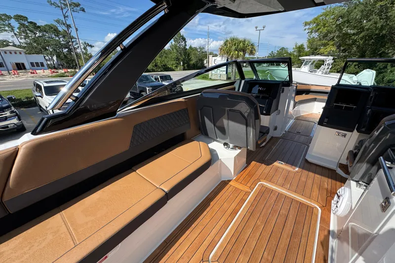  Yacht Photos Pics 2024 Cobalt R33 boat interior with luxurious seating and sleek design.