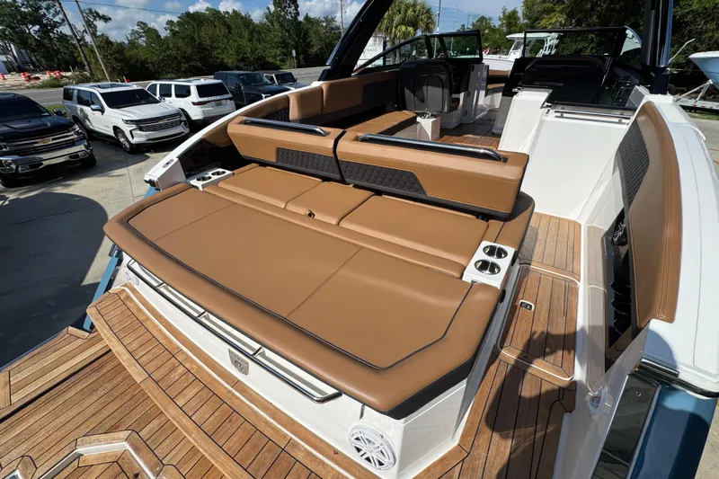  Yacht Photos Pics 2024 Cobalt R33 boat with luxurious tan seating and sleek design.