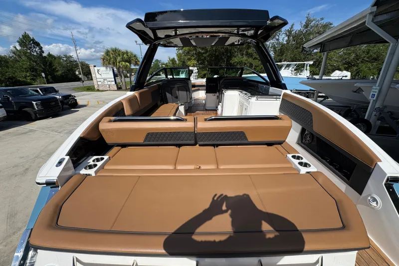  Yacht Photos Pics 2024 Cobalt R33 boat with luxurious tan seating and sleek design.