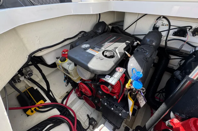  Yacht Photos Pics 2024 Cobalt R33 engine compartment with Volvo Penta engine, showcasing detailed components and wiring.