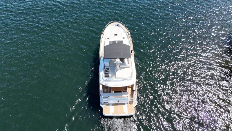  Yacht Photos Pics Aerial view of 2024 Greenline 48 Fly yacht cruising on open water.