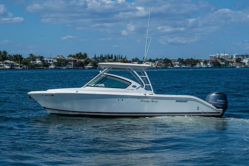 T/t Lucky Seven Yacht Photos Pics 2022 Pursuit DC 266 Dual Console boat cruising on a sunny day.