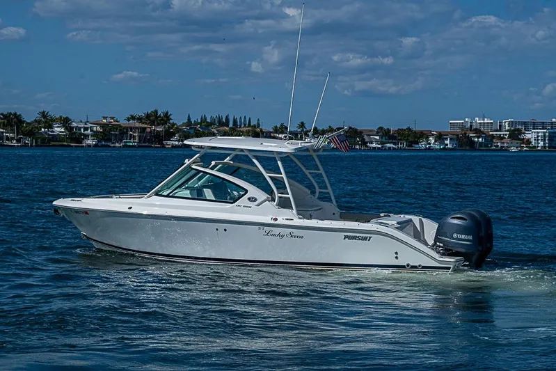 T/t Lucky Seven Yacht Photos Pics 2022 Pursuit DC 266 Dual Console boat cruising on a sunny day.