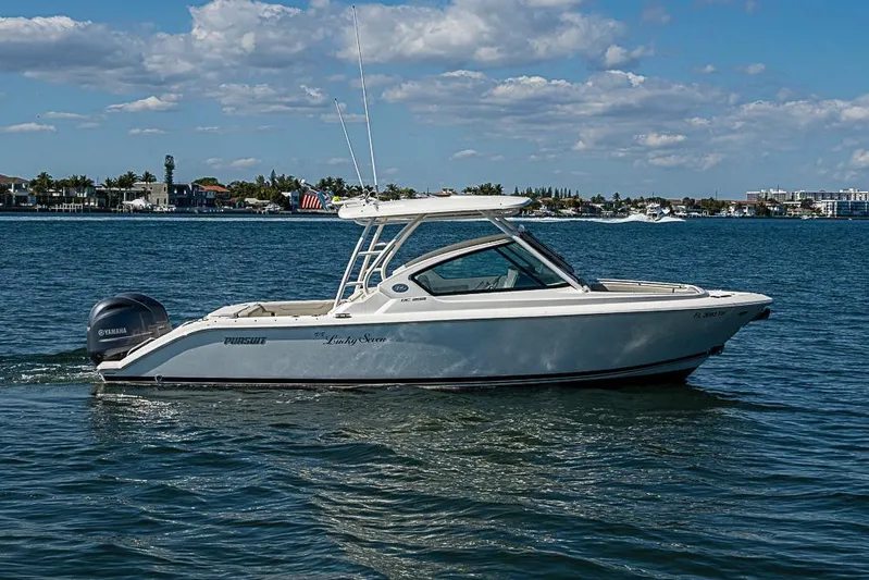 T/t Lucky Seven Yacht Photos Pics 2022 Pursuit DC 266 Dual Console boat cruising on a sunny day.