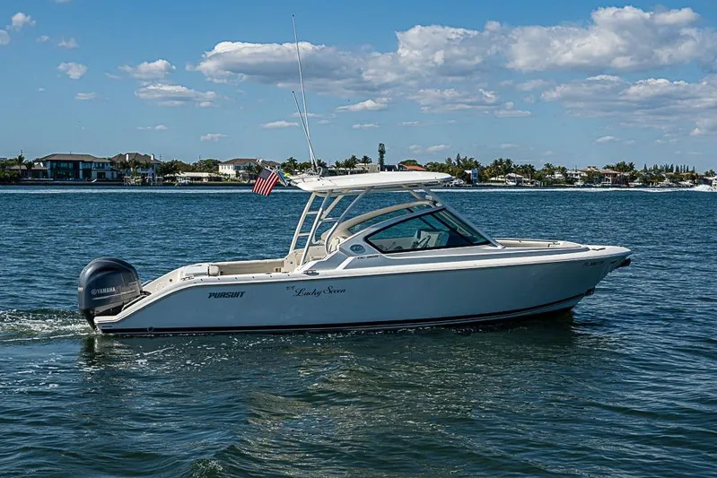 T/t Lucky Seven Yacht Photos Pics 2022 Pursuit DC 266 Dual Console boat cruising on a sunny day.