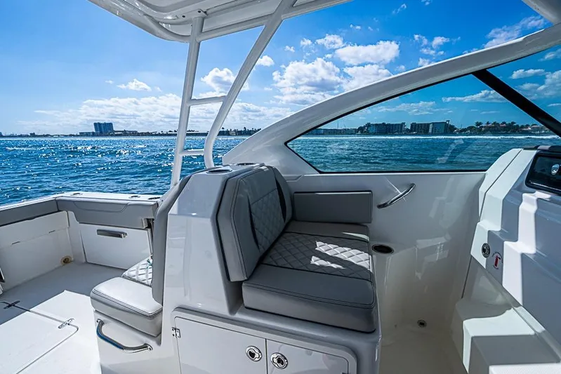 T/t Lucky Seven Yacht Photos Pics 2022 Pursuit DC 266 Dual Console boat interior with ocean view.