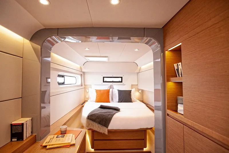  Yacht Photos Pics Luxurious cabin interior of 2023 CNB EXCESS 15 yacht with modern design and cozy bedding.