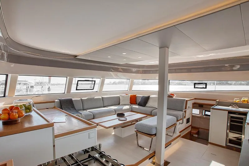  Yacht Photos Pics Luxurious interior of 2023 CNB EXCESS 15 yacht with modern seating and panoramic windows.