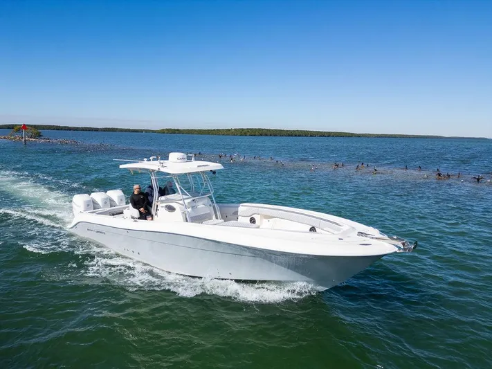 Trident Yacht Photos Pics 2007 Hydra-Sports Vector 3300 CC cruising on open water.