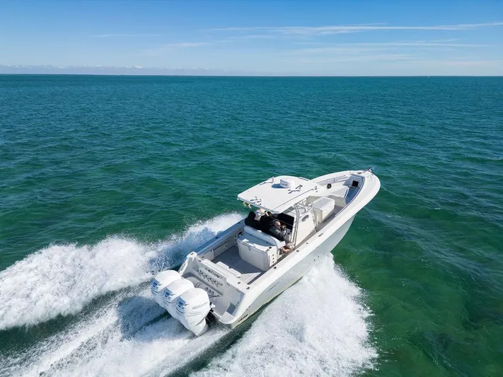 Trident Yacht Photos Pics 2007 Hydra-Sports Vector 3300 CC cruising on open water, showcasing powerful twin engines.