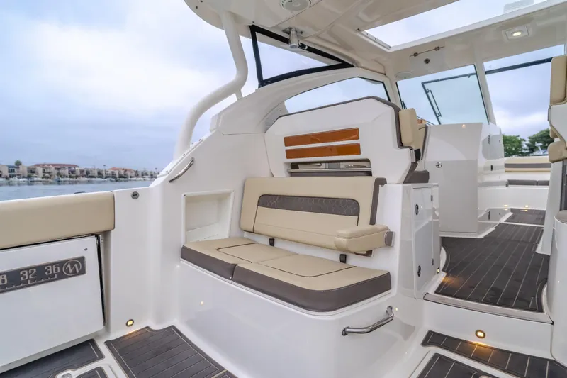  Yacht Photos Pics Luxurious 2018 Pursuit boat interior with comfortable seating and modern design.