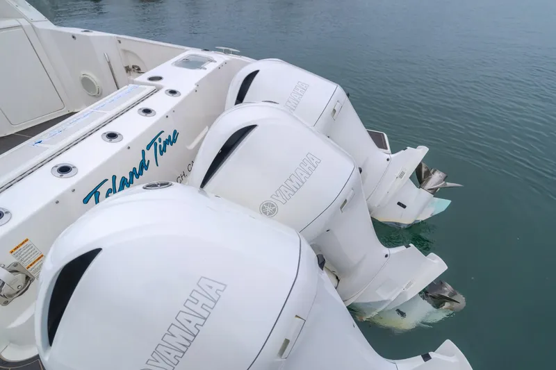  Yacht Photos Pics 2018 Pursuit boat with Yamaha outboard engines on calm water.