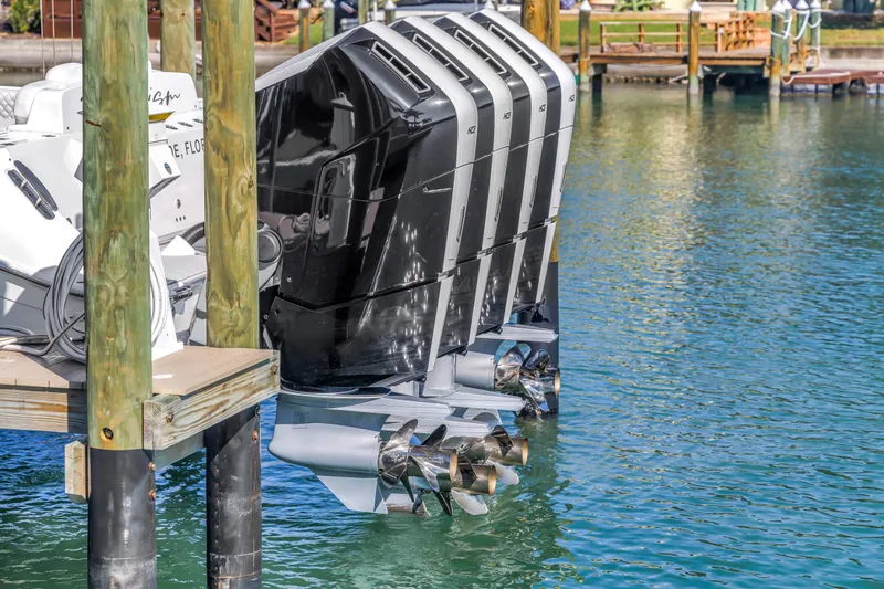 Best Deal Yacht Photos Pics 2023 HCB 53 Suenos RXV boat engines docked on clear water.